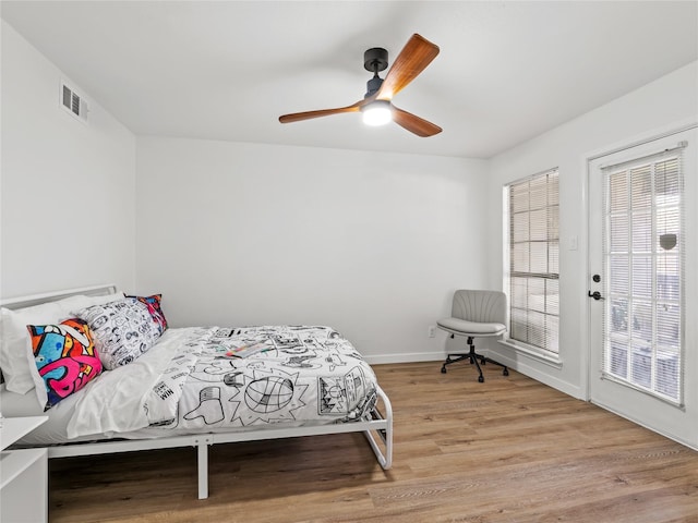 3101 Townbluff Dr Unit 922, Plano, TX 75075 - bedroom featuring wood finished floors and ceiling fan