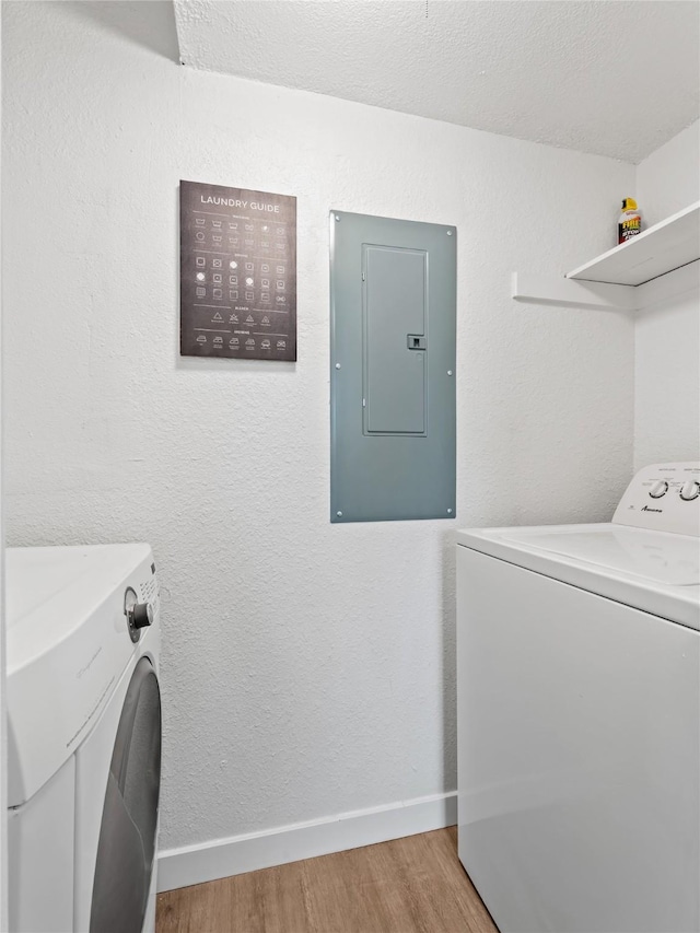3101 Townbluff Dr Unit 922, Plano, TX 75075 - laundry area with electric panel, washer and clothes dryer, and light wood-type flooring