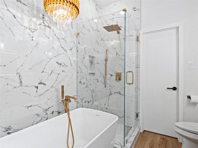 3101 Townbluff Dr Unit 922, Plano, TX 75075 - bathroom with a soaking tub, a chandelier, a marble finish shower, and wood finished floors
