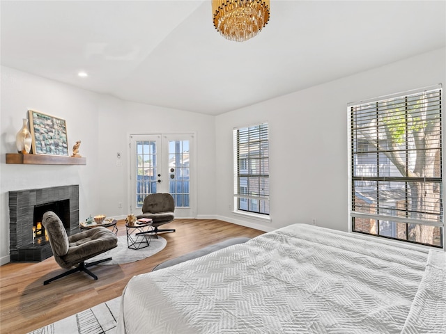3101 Townbluff Dr Unit 922, Plano, TX 75075 - bedroom with vaulted ceiling, access to outside, wood finished floors, a fireplace, and recessed lighting