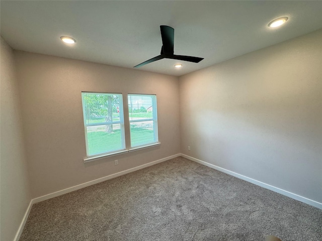 500 Ennis Scott St, Ferris, TX 75125 - carpeted empty room featuring a ceiling fan and recessed lighting