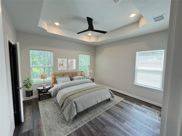 500 Ennis Scott St, Ferris, TX 75125 - bedroom with a raised ceiling, dark wood finished floors, recessed lighting, and a ceiling fan