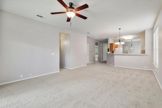626 Oakland Hills Ln, Frisco, TX 75036 - unfurnished living room featuring a ceiling fan, healthy amount of natural light, light colored carpet, and a chandelier