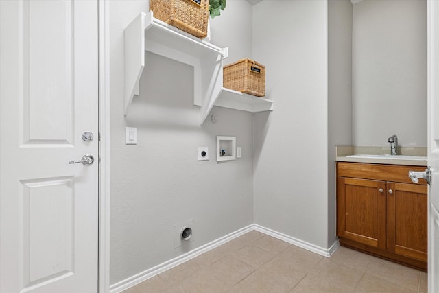 626 Oakland Hills Ln, Frisco, TX 75036 - laundry area featuring hookup for an electric dryer, hookup for a washing machine, and light tile patterned floors