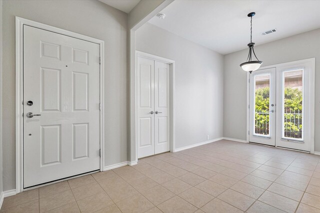 626 Oakland Hills Ln, Frisco, TX 75036 - foyer entrance featuring french doors and light tile patterned floors