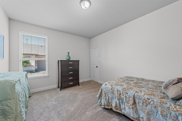 2209 Therese Dr, Waco, TX 76712 - carpeted bedroom featuring baseboards
