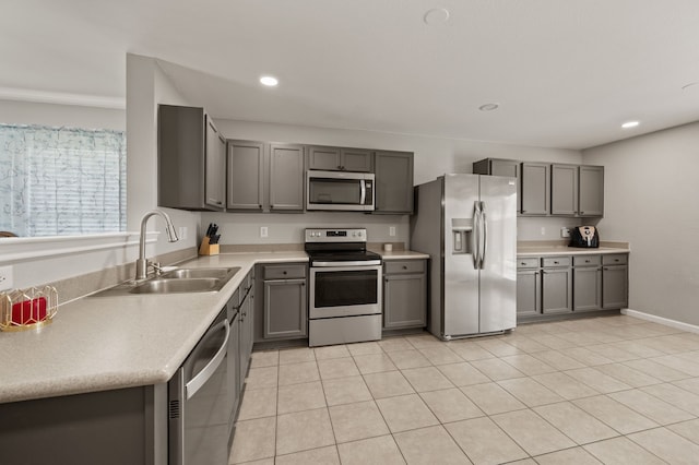 4505 Martingale View Ln, Fort Worth, TX 76244 - kitchen featuring appliances with stainless steel finishes, gray cabinetry, light countertops, recessed lighting, and light tile patterned floors