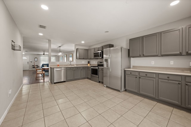 4505 Martingale View Ln, Fort Worth, TX 76244 - kitchen featuring stainless steel appliances, gray cabinetry, recessed lighting, light countertops, and light tile patterned flooring