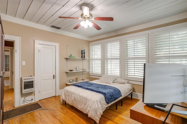 501 W Parks Ave, Waxahachie, TX 75165 - bedroom featuring heating unit, ornamental molding, wood finished floors, wood ceiling, and a ceiling fan