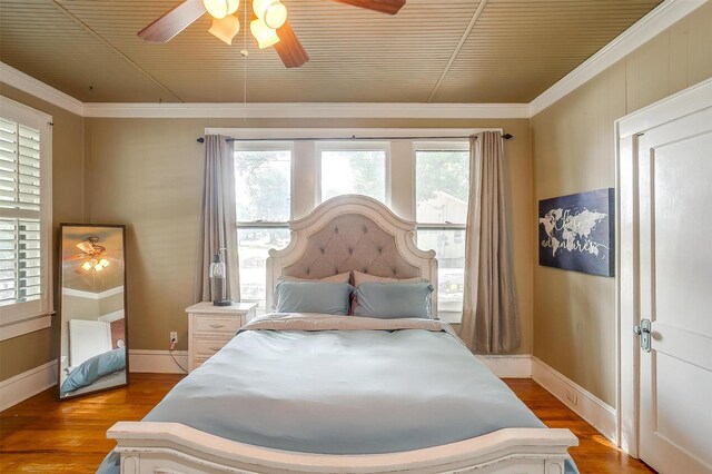 501 W Parks Ave, Waxahachie, TX 75165 - bedroom with wood finished floors, crown molding, and ceiling fan