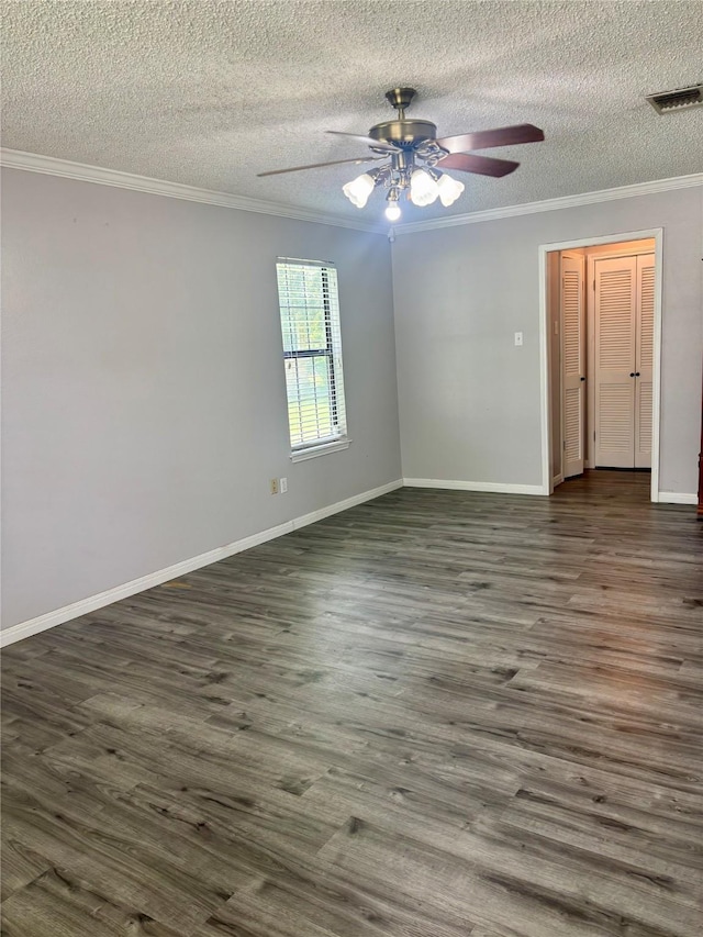 1006 S State Highway 14, Thornton, TX 76687 - unfurnished room with ornamental molding, a ceiling fan, a textured ceiling, and dark wood finished floors