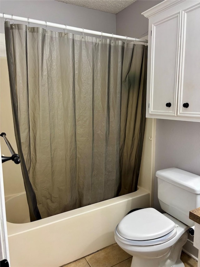 1006 S State Highway 14, Thornton, TX 76687 - full bath with shower / bathtub combination with curtain, tile patterned floors, and a textured ceiling