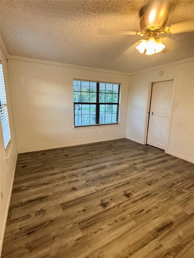 1006 S State Highway 14, Thornton, TX 76687 - spare room with dark wood-type flooring, crown molding, a textured ceiling, and ceiling fan