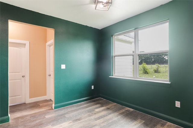 392 Calle Cedro Dr, Sherman, TX 75090 - unfurnished room featuring wood finished floors and baseboards