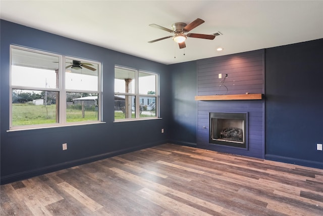 392 Calle Cedro Dr, Sherman, TX 75090 - unfurnished living room with a ceiling fan, a fireplace, wood finished floors, and recessed lighting