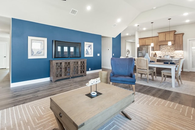 121 Emperor Oak Ct, Balch Springs, TX 75181 - living area with wood finished floors, lofted ceiling, and recessed lighting