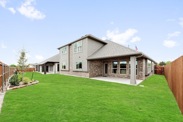 121 Emperor Oak Ct, Balch Springs, TX 75181 - back of house with brick siding, a patio, a fenced backyard, and a shingled roof