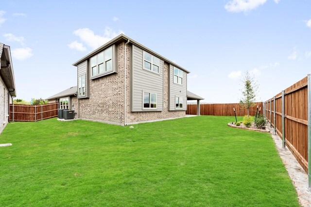121 Emperor Oak Ct, Balch Springs, TX 75181 - rear view of house with brick siding and a fenced backyard
