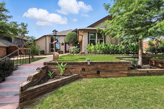 6604 Kingsferry Ct, Arlington, TX 76016 - view of front facade with brick siding and a front yard