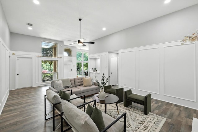 6604 Kingsferry Ct, Arlington, TX 76016 - living room featuring a decorative wall, a ceiling fan, recessed lighting, dark wood-type flooring, and wainscoting