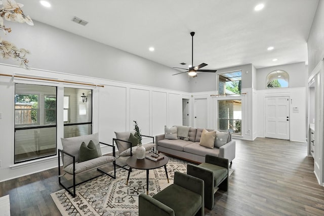 6604 Kingsferry Ct, Arlington, TX 76016 - living area with a decorative wall, a ceiling fan, recessed lighting, dark wood-type flooring, and a towering ceiling