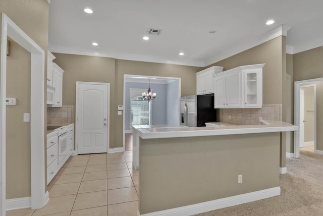 245 Harders Crossing Blvd, Shreveport, LA 71106 - kitchen with stainless steel fridge with ice dispenser, tasteful backsplash, a chandelier, crown molding, and white cabinets