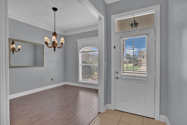 245 Harders Crossing Blvd, Shreveport, LA 71106 - foyer featuring a chandelier, healthy amount of natural light, light wood-style floors, and crown molding