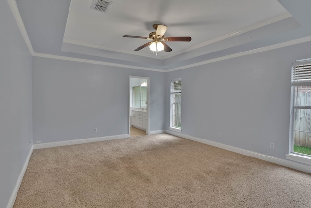 245 Harders Crossing Blvd, Shreveport, LA 71106 - unfurnished room with a tray ceiling, crown molding, light colored carpet, and a ceiling fan