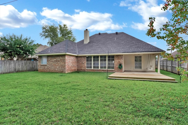 245 Harders Crossing Blvd, Shreveport, LA 71106 - back of property with a fenced backyard, brick siding, a wooden deck, a chimney, and a shingled roof