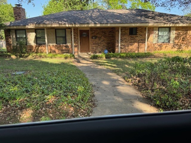 1006 Denmark St, Grand Prairie, TX 75050 - ranch-style home featuring a chimney and brick siding