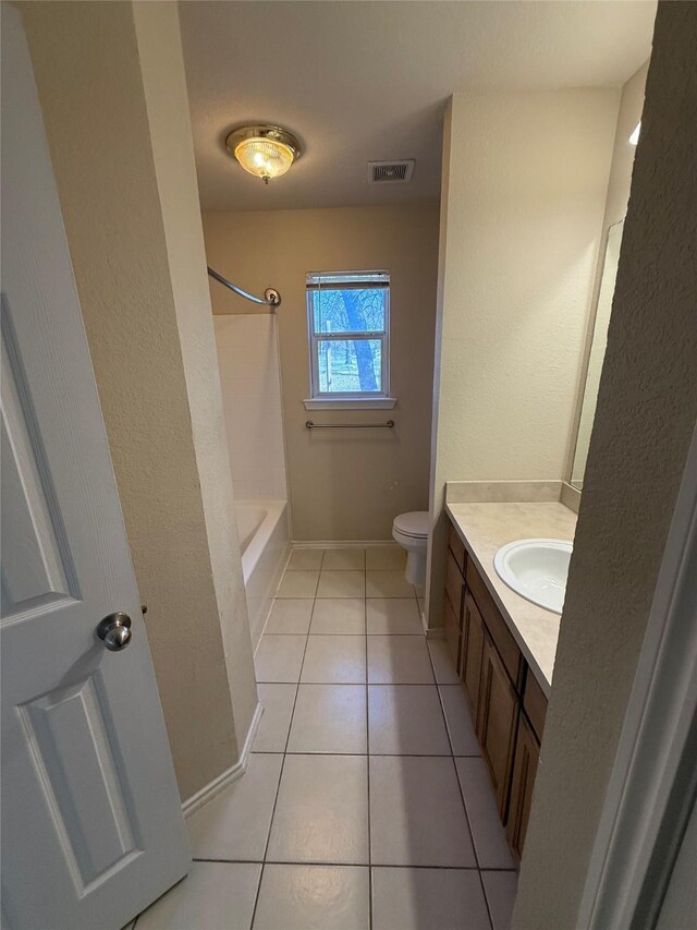 900 Reese Ln, Azle, TX 76020 - bathroom featuring vanity, tile patterned flooring, and bathtub / shower combination