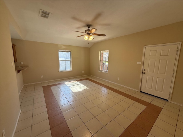 900 Reese Ln, Azle, TX 76020 - empty room with light tile patterned flooring, ceiling fan, and vaulted ceiling