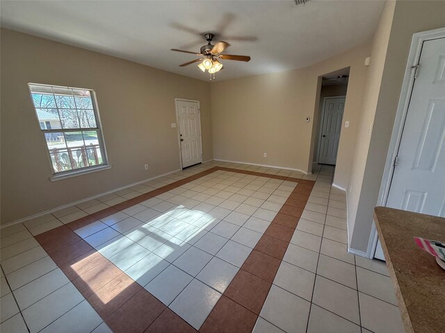 900 Reese Ln, Azle, TX 76020 - spare room with light tile patterned floors and ceiling fan