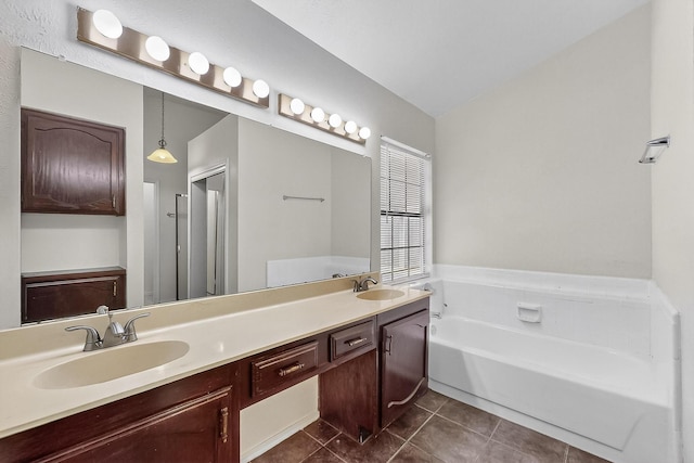 2411 Brookdale Dr, Arlington, TX 76014 - full bath featuring tile patterned floors, a bath, and double vanity
