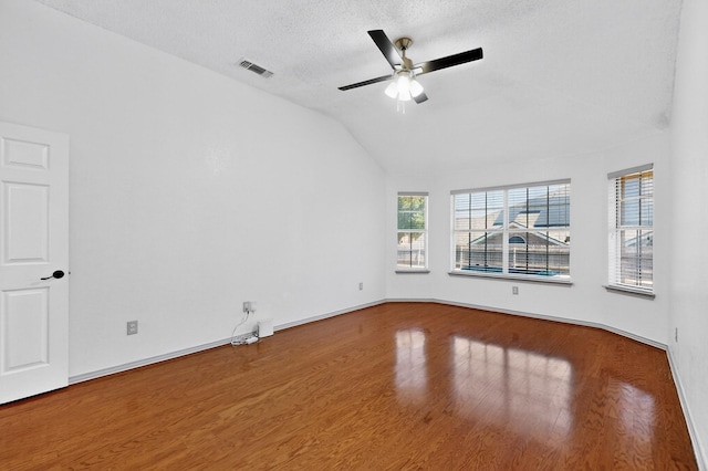 201 Settlers Glen Trl, Arlington, TX 76002 - unfurnished room with lofted ceiling, wood finished floors, ceiling fan, and a textured ceiling