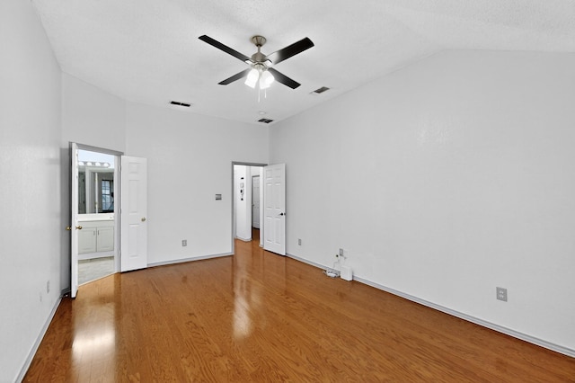 201 Settlers Glen Trl, Arlington, TX 76002 - unfurnished bedroom featuring wood finished floors, ensuite bathroom, high vaulted ceiling, and a ceiling fan