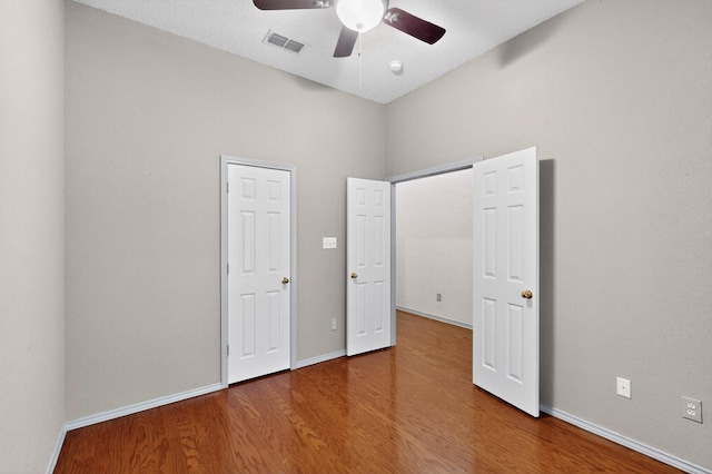 201 Settlers Glen Trl, Arlington, TX 76002 - unfurnished bedroom with wood finished floors and a ceiling fan