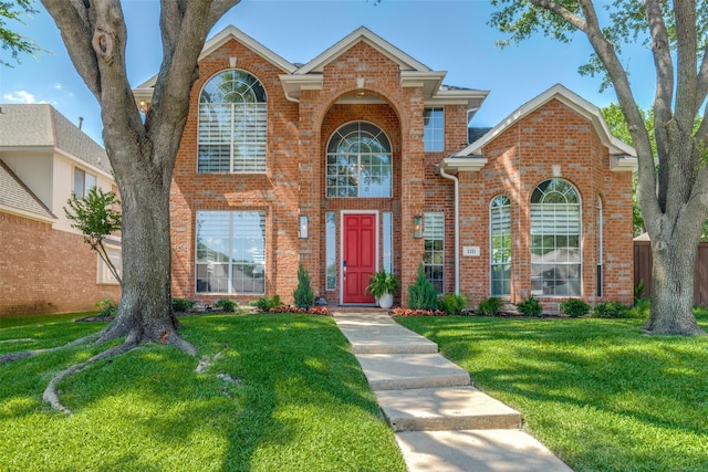 2521 Glen Morris Rd, Carrollton, TX 75007 - traditional-style house with brick siding and a front lawn