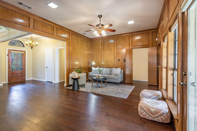 6515 Genstar Ln, Dallas, TX 75252 - living room featuring a chandelier, dark wood finished floors, ceiling fan, and ornamental molding