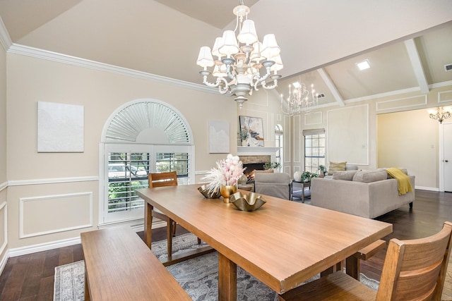 6515 Genstar Ln, Dallas, TX 75252 - dining area featuring a chandelier, dark wood-type flooring, a warm lit fireplace, a decorative wall, and plenty of natural light
