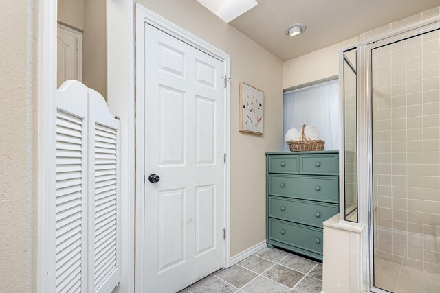 6515 Genstar Ln, Dallas, TX 75252 - bathroom featuring a stall shower, tile patterned floors, and a closet