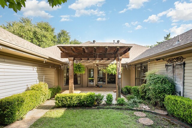 6515 Genstar Ln, Dallas, TX 75252 - back of property featuring a pergola, a patio, a shingled roof, and a lawn