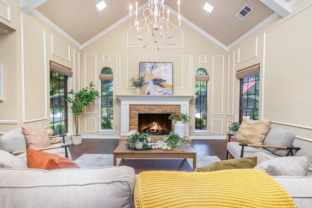 6515 Genstar Ln, Dallas, TX 75252 - living room featuring a decorative wall, wood finished floors, a chandelier, high vaulted ceiling, and plenty of natural light
