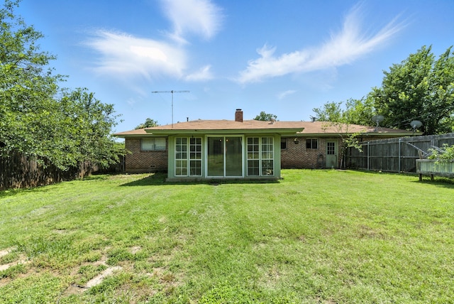 1442 W Water St, Weatherford, TX 76086 - rear view of property featuring brick siding, a chimney, and a sunroom
