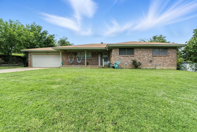 1442 W Water St, Weatherford, TX 76086 - single story home with brick siding, a garage, a front yard, and driveway