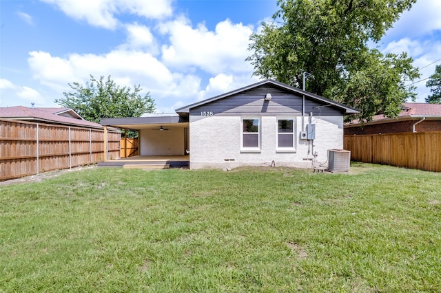 1528 Ridgeview St, Mesquite, TX 75149 - back of house featuring ceiling fan, brick siding, and a fenced backyard