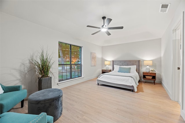 2001 Boulder Dr, Plano, TX 75023 - bedroom with light wood finished floors and ceiling fan