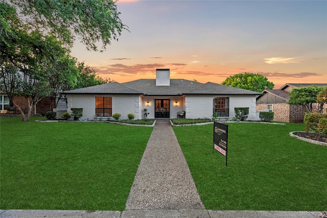 2001 Boulder Dr, Plano, TX 75023 - view of front of house featuring a lawn, a chimney, french doors, and roof with shingles
