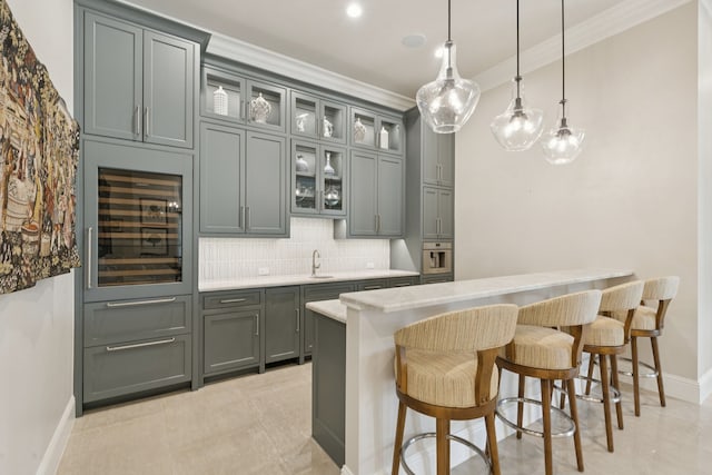 1806 Scenic Cir, Westlake, TX 76262 - indoor bar featuring beverage cooler, decorative backsplash, pendant lighting, oven, and crown molding