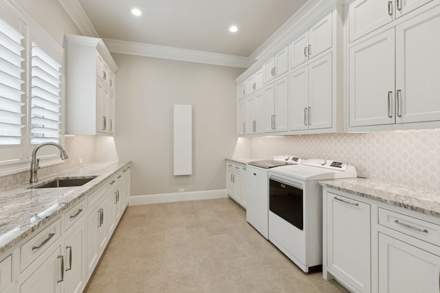 1806 Scenic Cir, Westlake, TX 76262 - washroom with washing machine and clothes dryer, crown molding, cabinet space, and recessed lighting